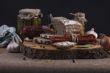 Pickles. Salted Cucumbers still-life with dark bread