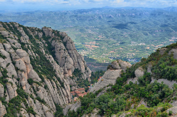Fototapeta na wymiar Benedictine abbey Santa Maria de Montserrat on the mountain of Montserrat 