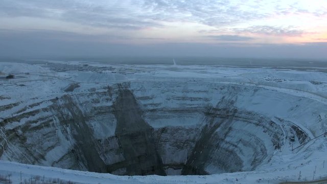 Epic ferial view of old abandoned open mining pit at background of north morning