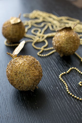 Golden balls christmas decoration on the black background