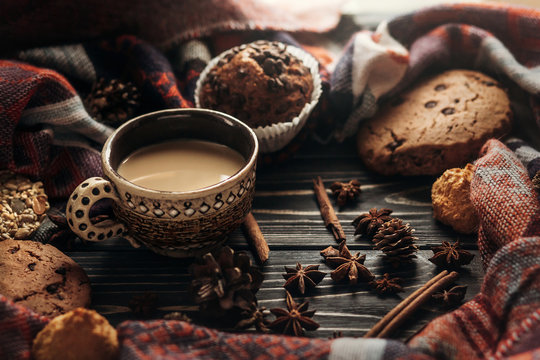 stylish rustic winter coffee cookies and spices on wooden backgr