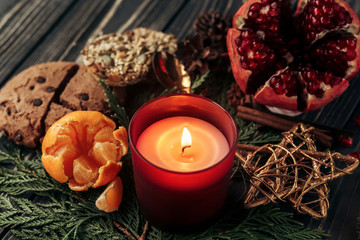 Obraz na płótnie Canvas stylish rustic christmas wallpaper candle and presents with red