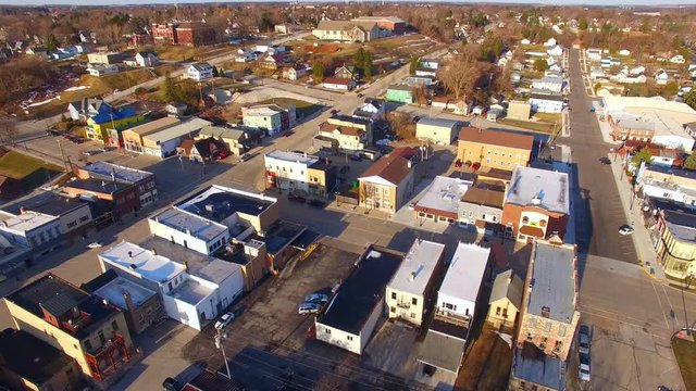 Scenic small town America,downtown area and hilly neighborhoods, time lapse aerial flyover.