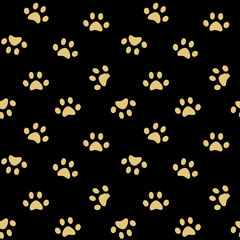 cute gold paw on black background seamless vector pattern illustration


