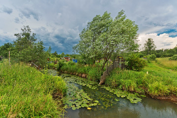 Green field with river