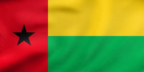 Flag of Guinea-Bissau waving, real fabric texture