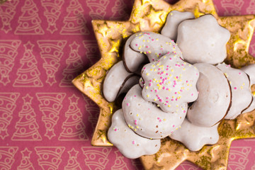 Christmas spicy cookies - colorful shaped cookies  on golden plate
