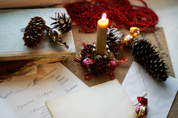Postcard on the table next to a candle
