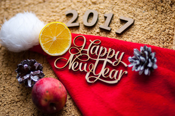 The wooden figures are on the hat of Santa Claus