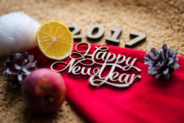 The wooden figures are on the hat of Santa Claus