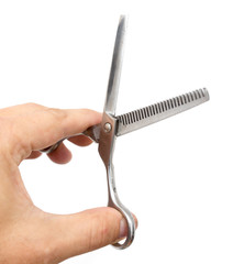 Thinning scissors in hand on white background