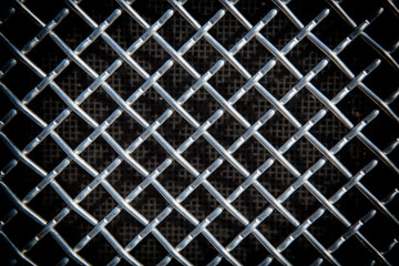 metal grid on black background