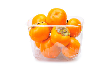 Persimmons in plastic box