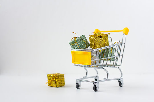 Trolley with gifts on white background