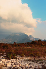 typical landscape of the lowland part of Montenegro - the mountains on the horizon and the blue sky