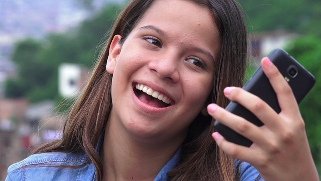 Silly Goofy Girl Making Funny Faces And Taking Selfy