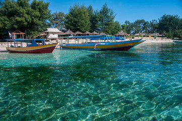 Fototapeta na wymiar Ferry boats moored on the beach, Gili Air, Gili Islands, Indonesia