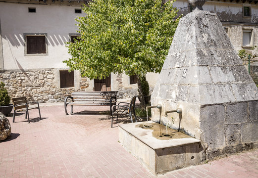 ancient stone made water fountain in Agés, Province of Burgos, Spain