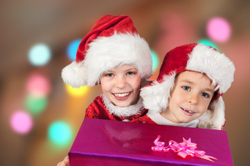 Fototapeta na wymiar Happy Christmas children with gifts