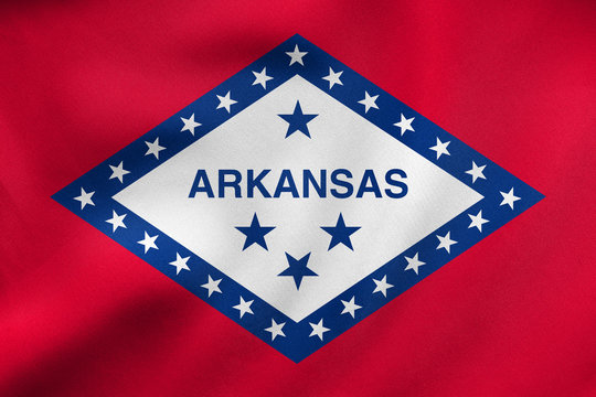 Flag of Arkansas waving, real fabric texture