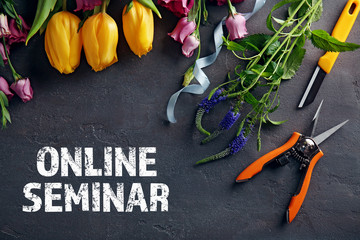 Text ONLINE SEMINAR with flowers on dark background. Florist and floral design tutorial concept.