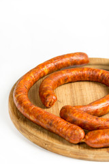 Raw homemade domestic sausage on the wooden board. Flat lay with