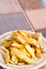 Roasted potatoes served on a plate
