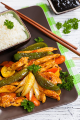 Chicken and Rice with Vegetable Spicy Sesame Teriyaki Wok Sauce. Selective focus.