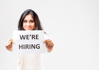 indian girl holding a hiring sign