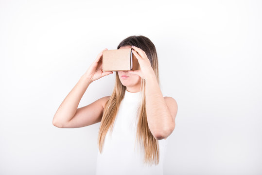 Young Female Model Holding Vr Cardboard Headset