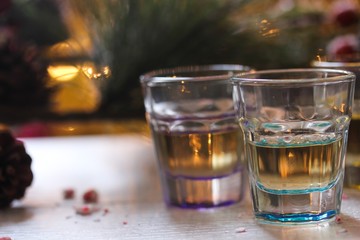 Shot glasses on holiday background