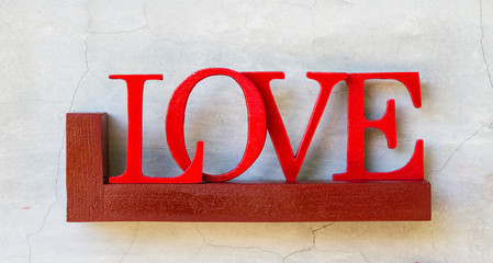 word love on wood shelf