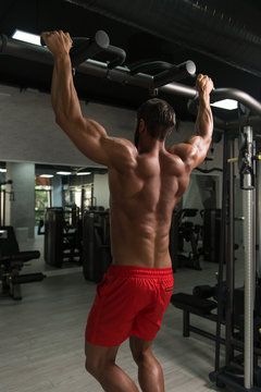 Male Bodybuilding Athlete Doing Pull Ups