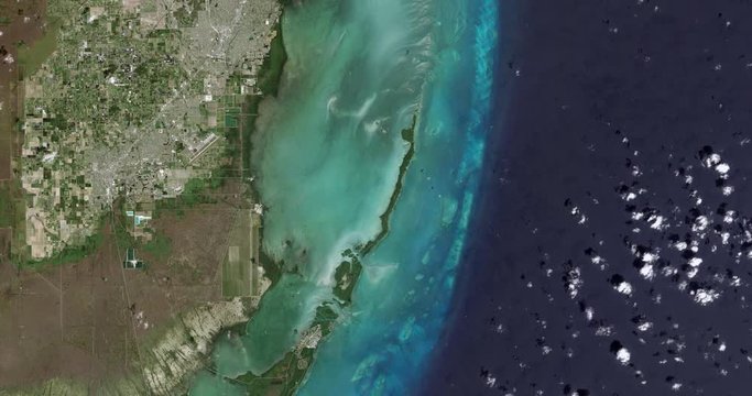 High-altitude overflight aerial of Biscayne National Park and nearby Homestead, Florida. Clip loops and is reversible. Elements of this image furnished by USGS/NASA Landsat 

