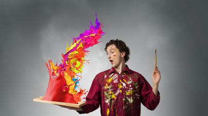 Fototapeta premium Guy painter waiting for inspiration . Mixed media