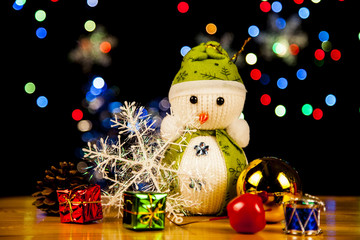 Festive snowman with Christmas light background