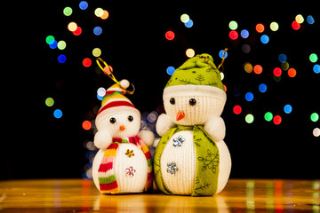 Festive snowman with Christmas light background