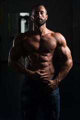 Fototapeta na wymiar Sexy Latin Man Posing In Gym