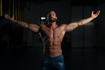 Fototapeta na wymiar Sexy Italian Man Posing In Gym