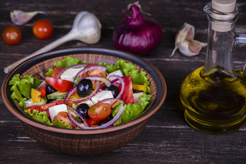 Fototapeta na wymiar Fresh vegetable greek salad on the table