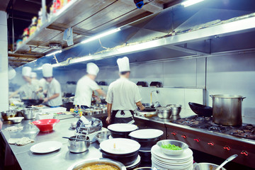 motion chefs of a restaurant kitchen