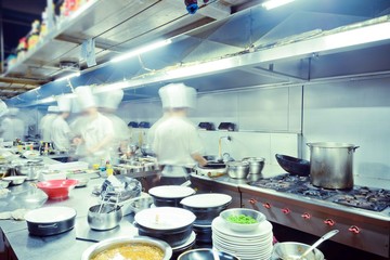 motion chefs of a restaurant kitchen