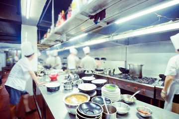 motion chefs of a restaurant kitchen