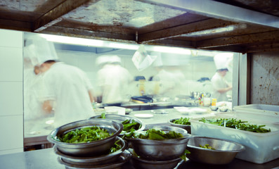 motion chefs of a restaurant kitchen
