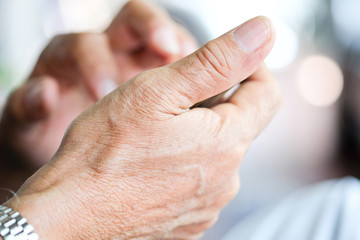 Close up of older man checking his phone background