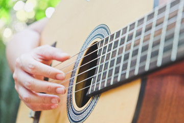 Fototapeta premium playing acoustic guitar