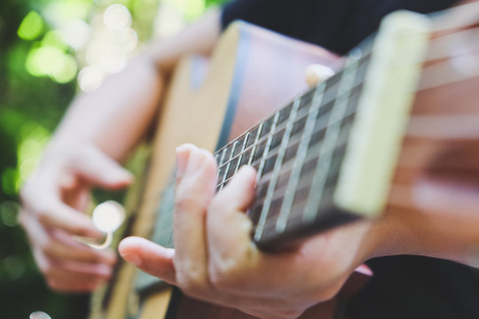 playing acoustic guitar