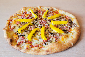 Pizza on wooden table