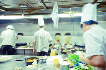 Fototapeta na wymiar motion chefs of a restaurant kitchen