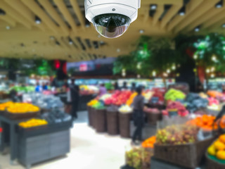 CCTV camera security in shopping mall with supermarket blur back